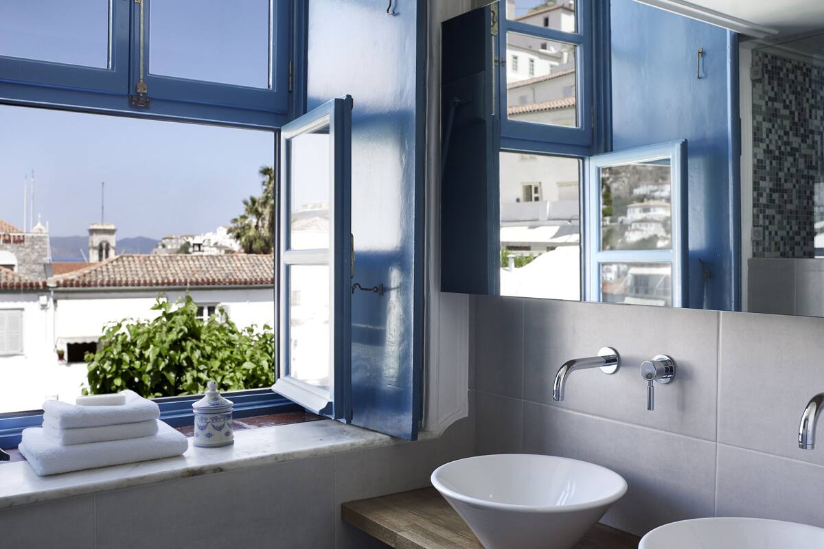 premium suite | bathroom | designer toiletries, hair dryer, bathrobes, slippers