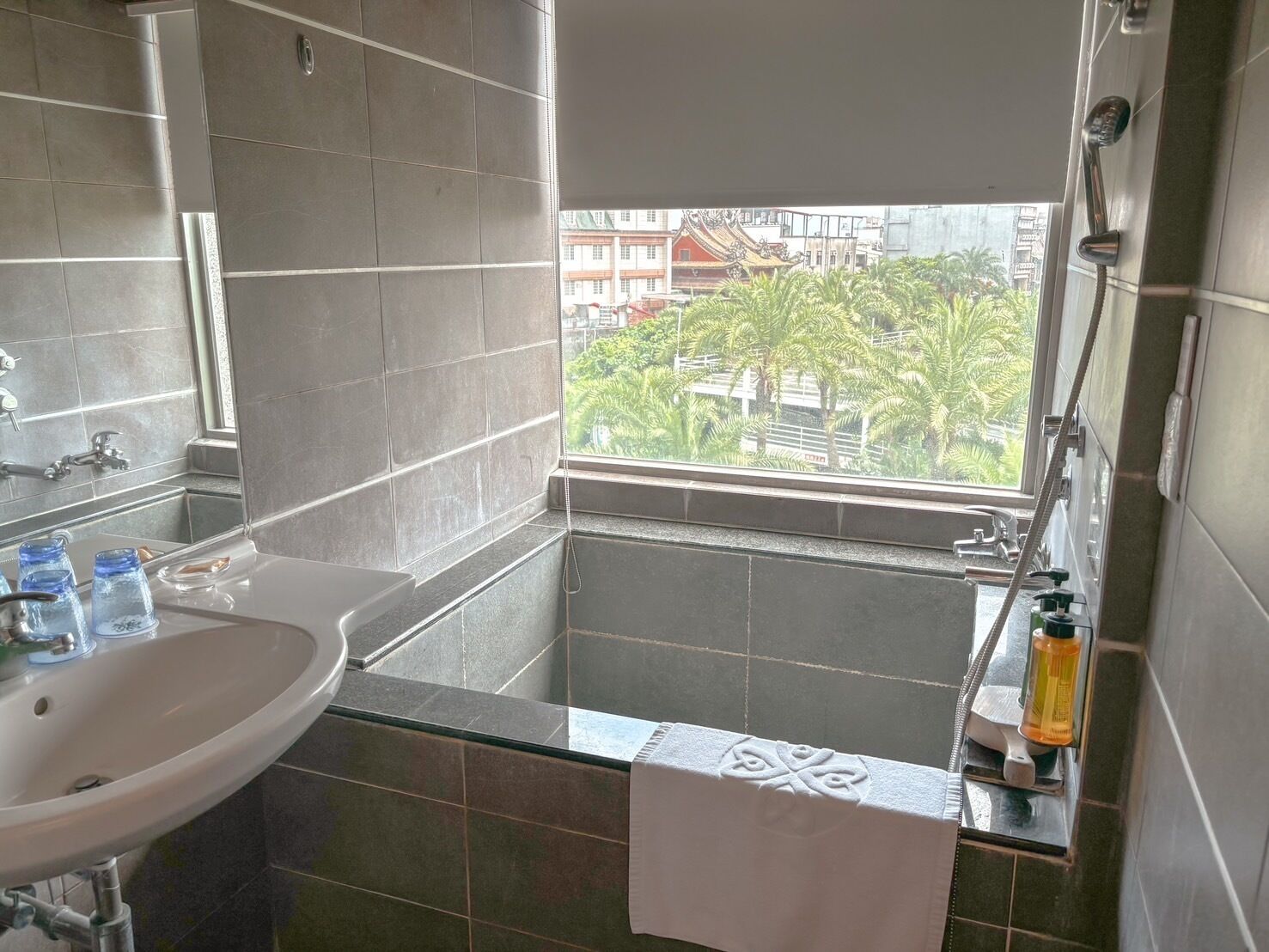 separate bathtub and shower, hair dryer, bathrobes, slippers