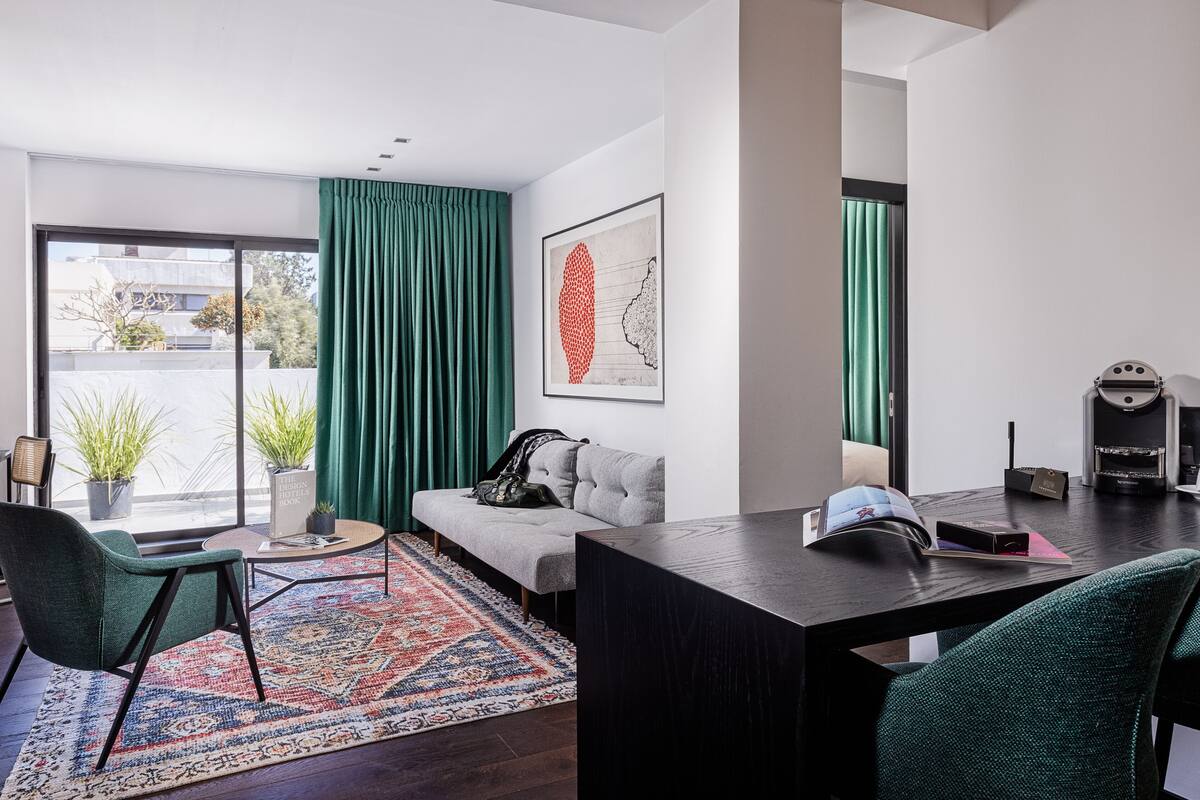 Deluxe Penthouse, Balcony, City View | Living room | 36-inch flat-screen TV with cable channels, TV, pay movies