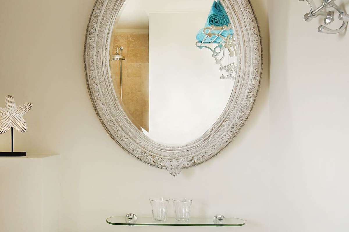 shower, rainfall showerhead, hair dryer, towels