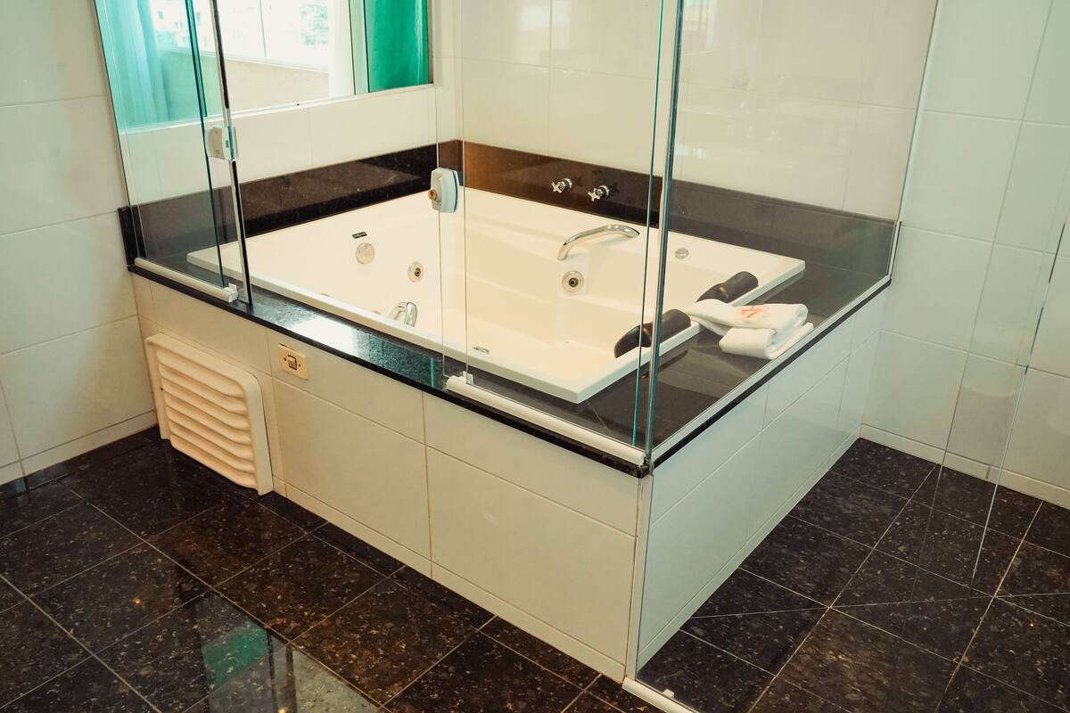 premium double room, 1 queen bed | bathroom | shower, hair dryer, towels