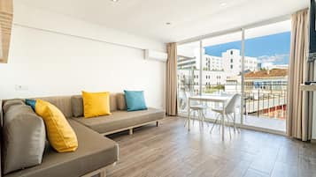 Superior Apartment | Living area | Flat-screen TV