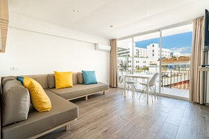 Superior Apartment | Living area | Flat-screen TV