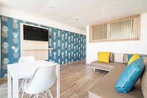 Superior Apartment | Living area | Flat-screen TV