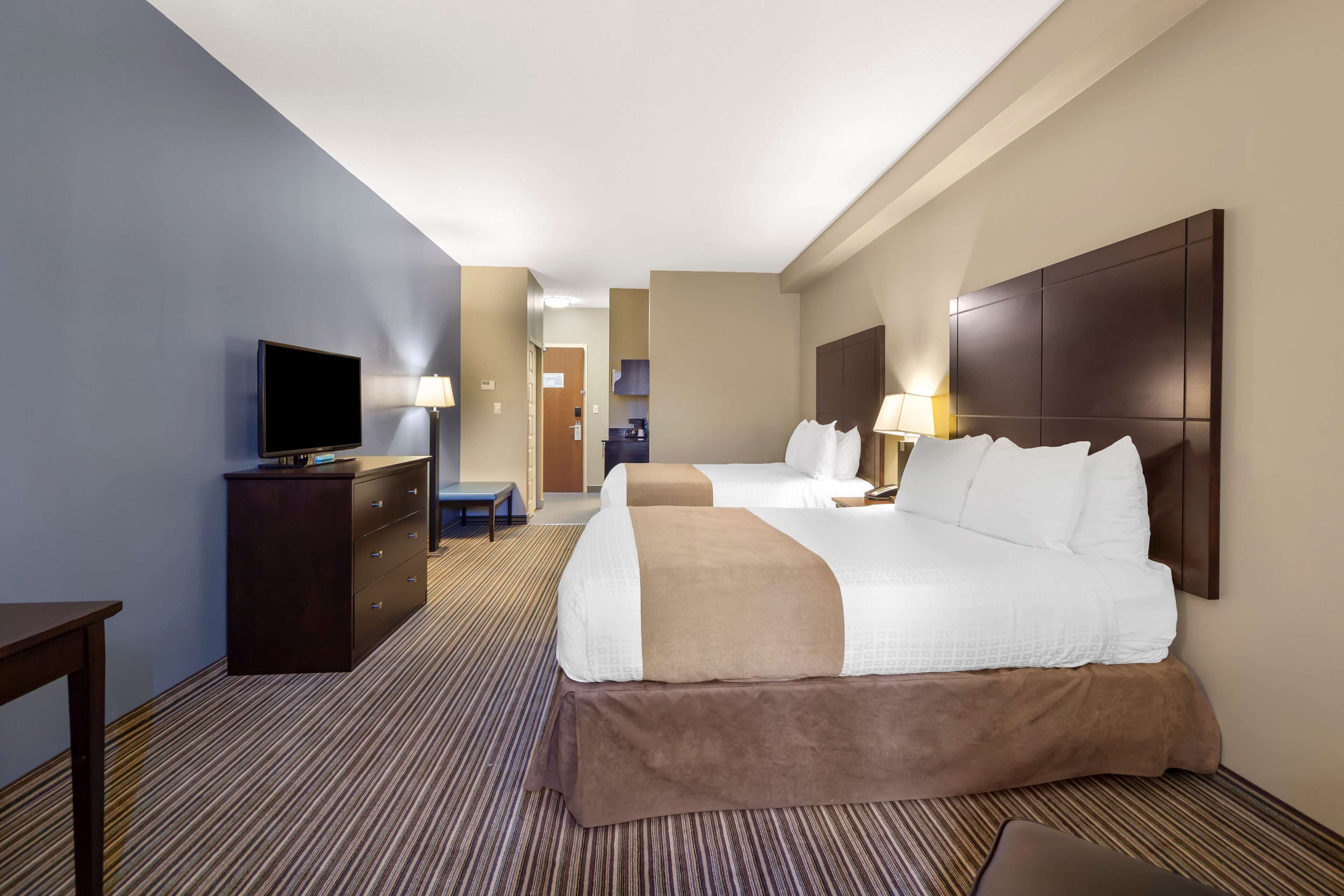 pillow-top beds, desk, laptop workspace, iron/ironing board