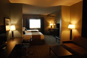 A hotel room with two beds, a desk, a chair, a sofa, and two lamps. - Best Western Plus Fort Saskatchewan Inn & Suites (Fort Saskatchewan)