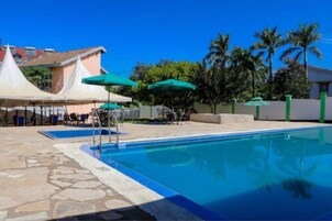 Outdoor pool, pool umbrellas, sun loungers