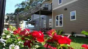 A two-story building with a balcony on the upper floor. - Choo Choo Lofts, 3 br, 2 bath, Full Kitchen - Lafayette, LA (Lafayette)