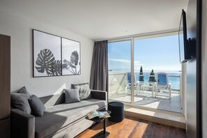 Junior Suite, Balcony, Sea View | Living area | 55-cm flat-screen TV with satellite channels, TV