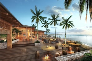 On the beach, white sand, sun loungers, beach umbrellas
