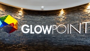 A wall with the text "GLOWPOINT" in large letters, a colorful geometric design, and a security camera. - Hotel Glow Point - Mulza (León)