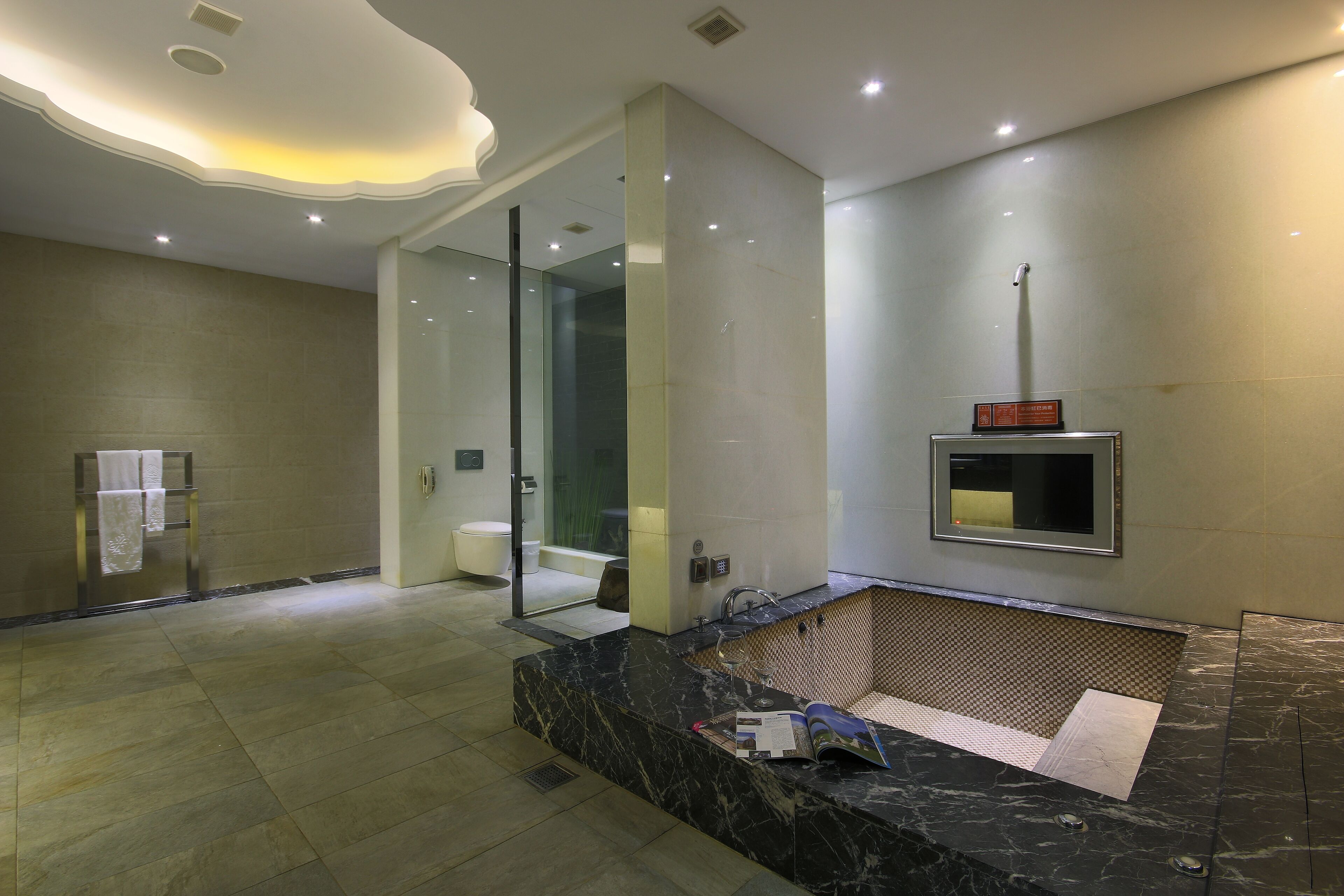 luxury suite | bathroom | separate bathtub and shower, deep-soaking bathtub, hair dryer, slippers