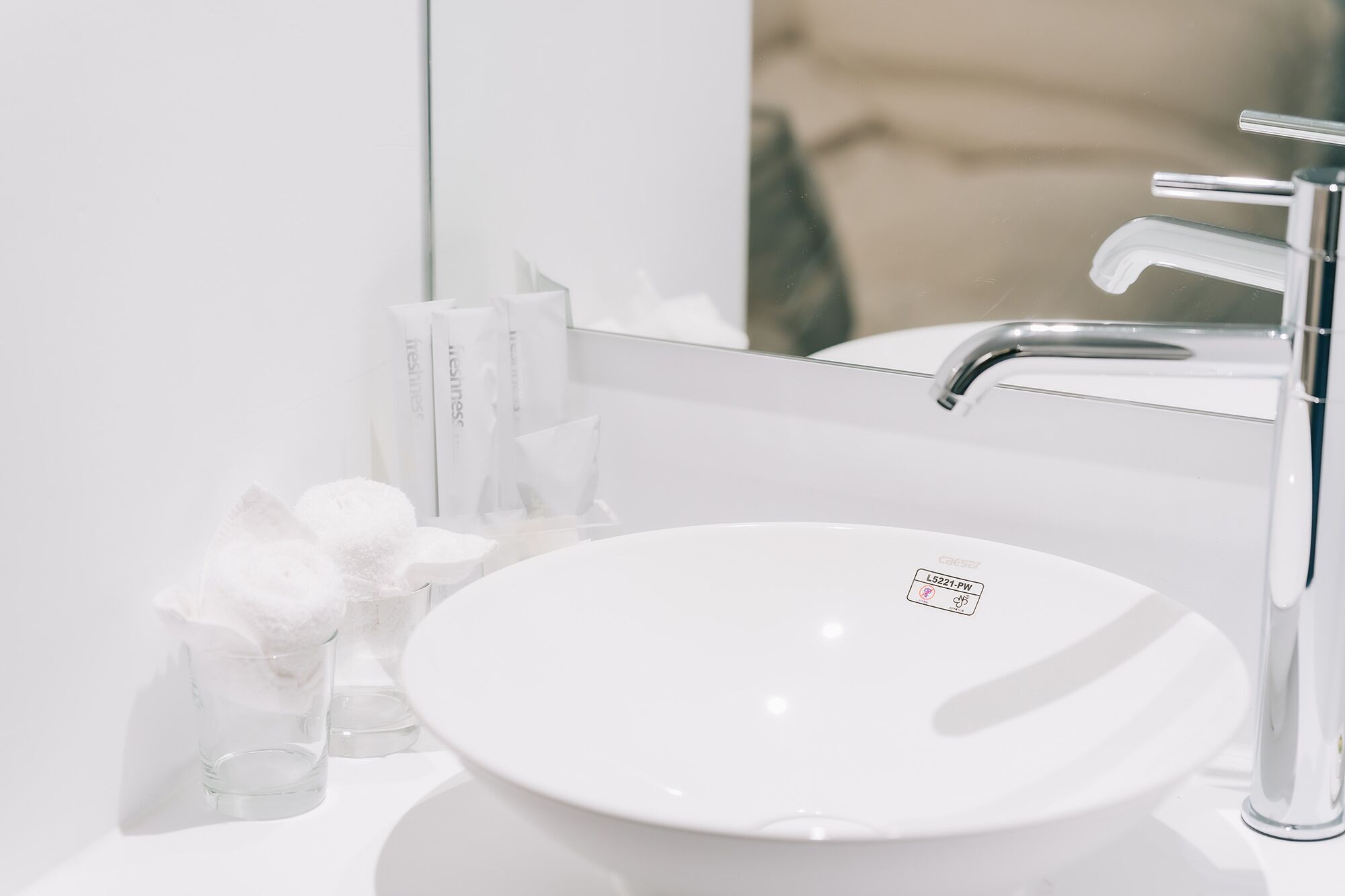 shower, hair dryer, towels, shampoo