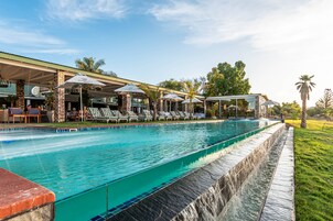 2 outdoor pools, pool umbrellas, pool loungers