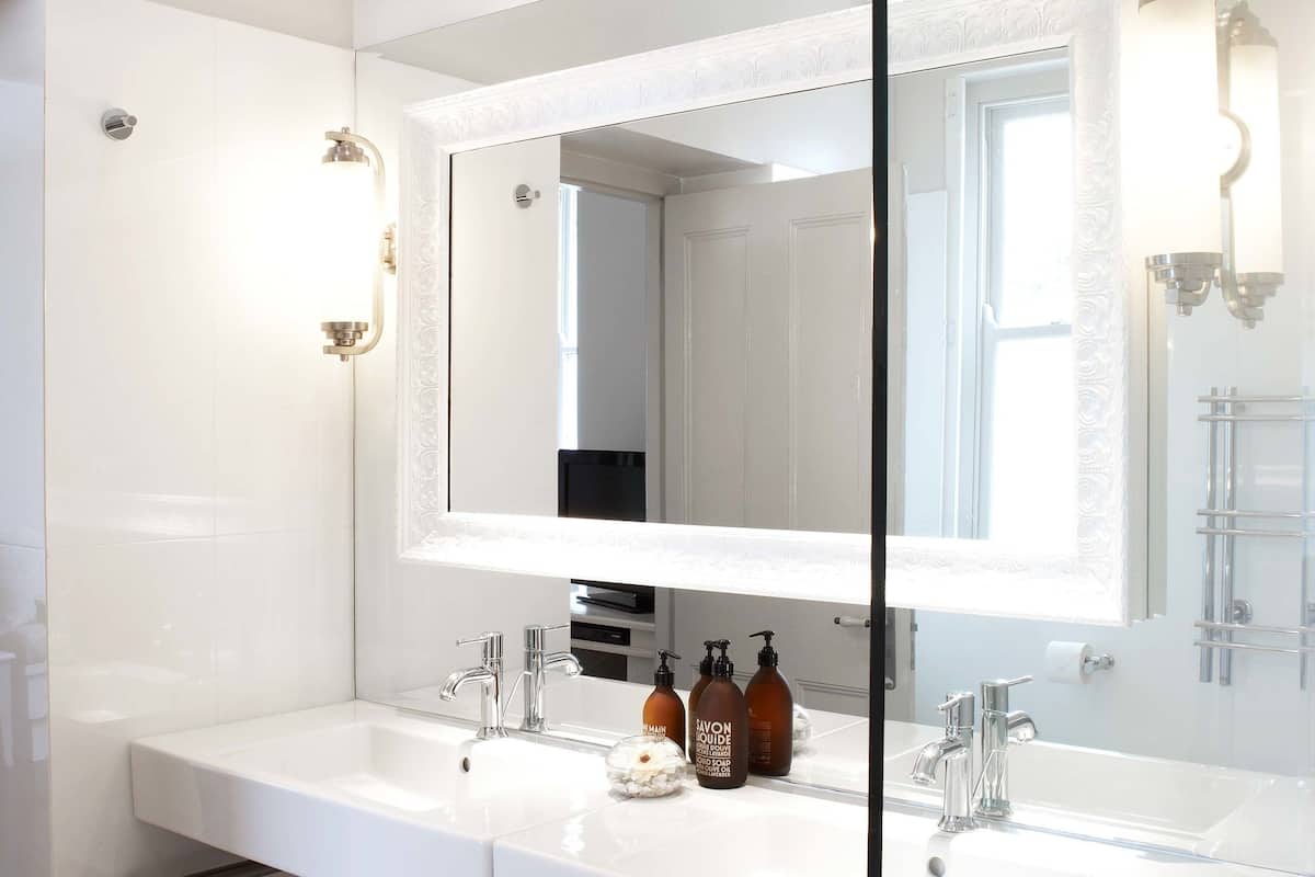 designer toiletries, hair dryer, bathrobes, slippers