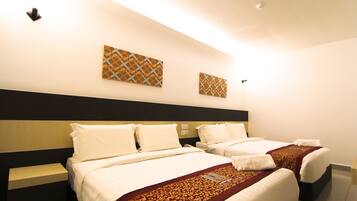 Family Quad | Individually decorated, individually furnished, desk, blackout drapes