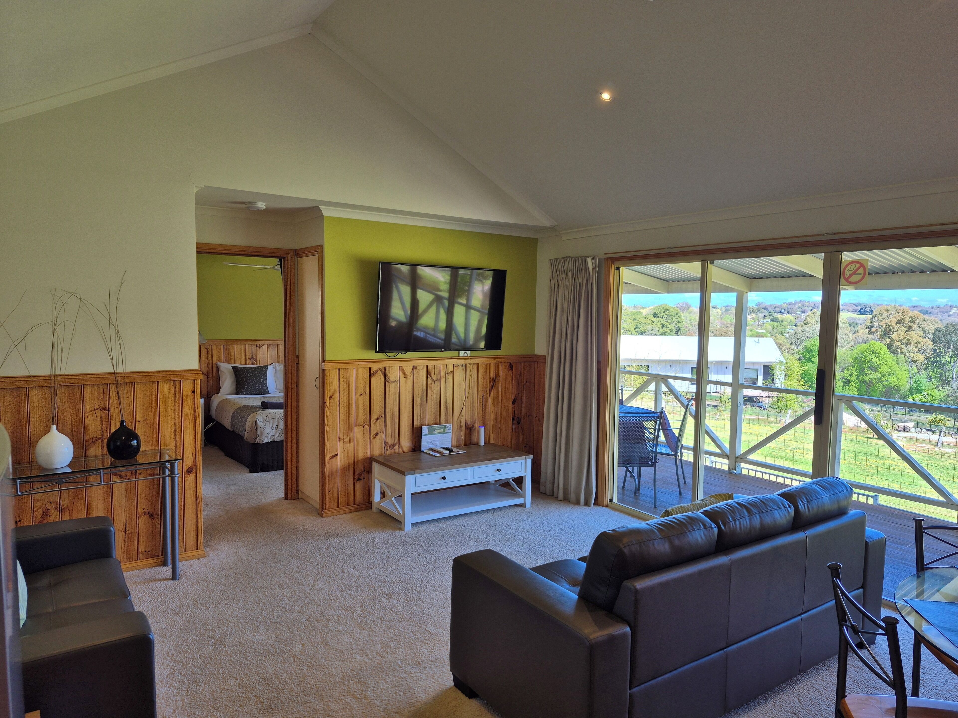 2 Bedrooms, 2 Bathrooms Self Contained Spa Cottage | Living area | 55-inch Smart TV with digital channels, TV