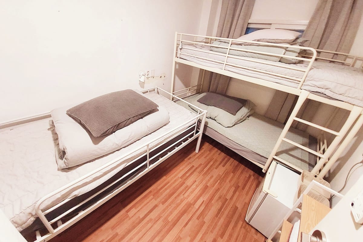 Economy Triple Room | Blackout drapes, iron/ironing board, free WiFi, bed sheets
