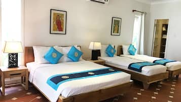 Family Quadruple Room, Garden View | Minibar, in-room safe, desk, soundproofing