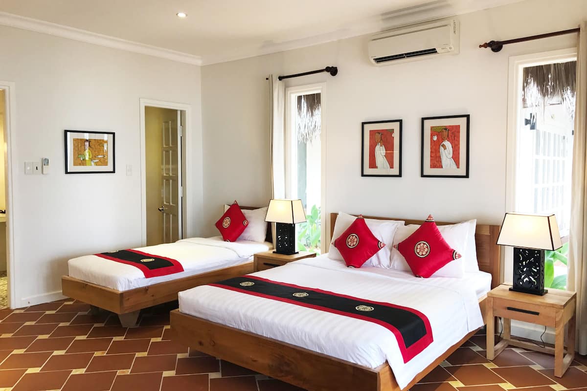 family triple room, beachfront | minibar, in-room safe, desk, soundproofing