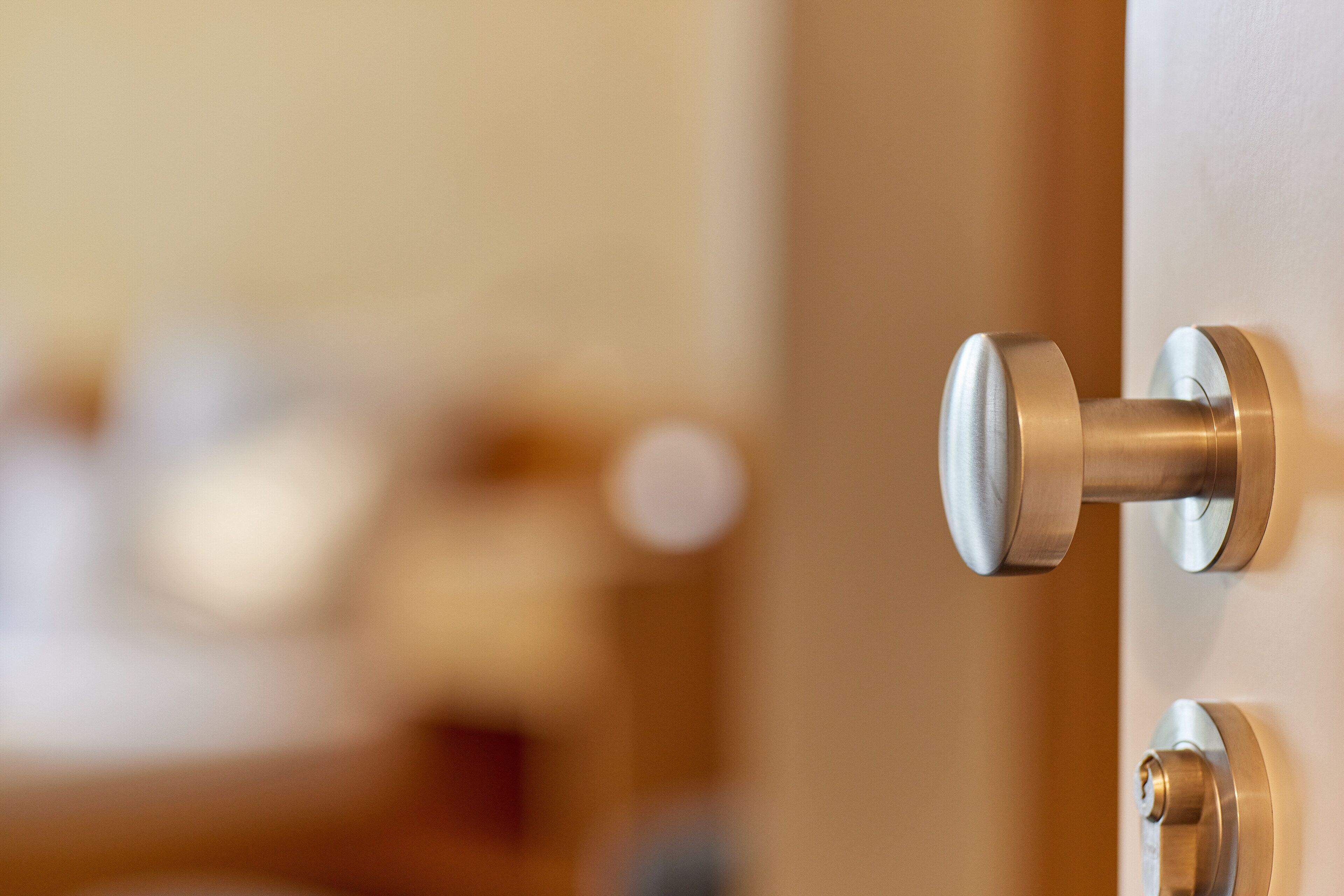 A close-up of a door handle and lock mechanism.