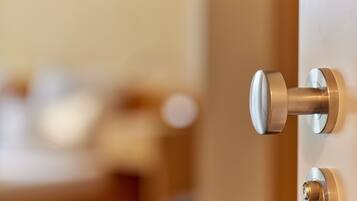 A close-up of a door handle and lock mechanism.