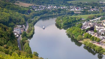 A river flowing through a town with houses on both sides.