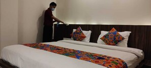 Deluxe Room, 1 King Bed, Accessible, Non Smoking | Minibar, in-room safe, desk, iron/ironing board - Hotel Grand Ambience (Ahmedabad)