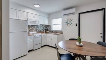Deluxe Apartment, 1 Bedroom, Accessible, Kitchen | Private kitchen | Full-size fridge, microwave, coffee/tea maker, cleaning supplies