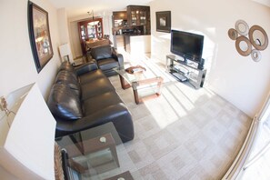 Executive Suite, 2 Bedrooms, Terrace, City View | Living room | 0-inch Smart TV with cable channels, TV, DVD player - Corporate Suites of Calgary - Eightwelve (Calgary)