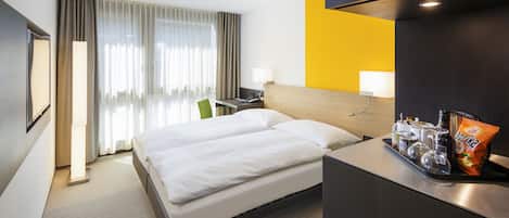 Ropa de cama de alta calidad, cubrecamas y minibar