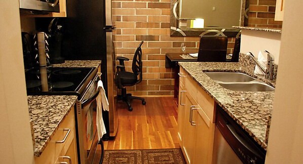 Condo, 1 Bedroom (Uptown 1BSS) | Private kitchen | Full-sized fridge, microwave, oven, stovetop - Corporate Suites of Calgary - Sunnyside (Calgary)