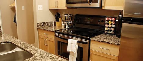 Condo, 1 Bedroom (Uptown 1BSS) | Private kitchen | Full-size fridge, microwave, oven, stovetop