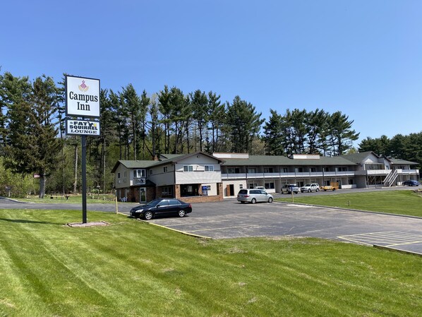 A campus inn with a sign for the Fatty Squirrel Lounge.