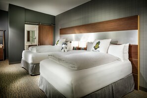 Premium bedding, pillow-top beds, desk, laptop workspace