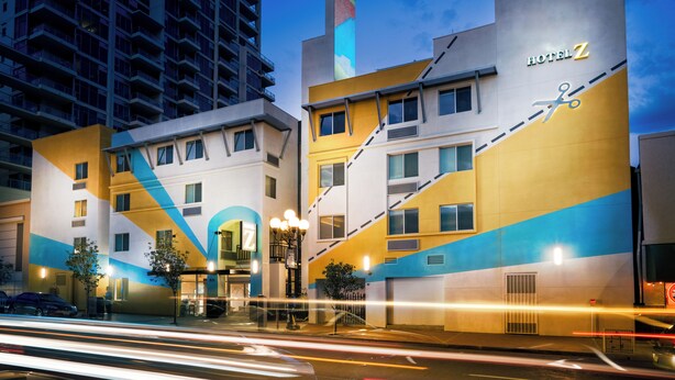 A hotel with a modern design, featuring a prominent 'Hotel Z' sign, a staircase, and a large window.
