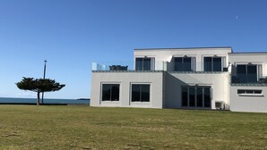 A modern two-story house with large windows and a flat roof. - East Pier Hotel (Napier)