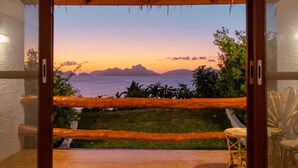 A balcony with a view of the sea and mountains at sunset. - El Nido Bayview Resort (El Nido)