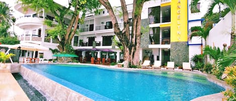 Outdoor pool, open 7 AM to 9 PM, pool umbrellas, pool loungers