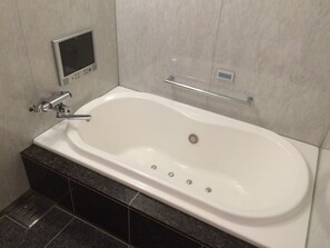 Separate bathtub and shower, free toiletries, hair dryer, slippers