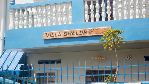 A building with a sign reading "VILLA SHALOM" and a number "75" on the wall. - Villa Shalom Guest House (Port of Spain)