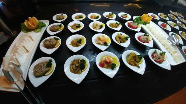 A variety of dishes arranged on a table, likely for a buffet or tasting event. - Club Alla Turca (Ortaca)