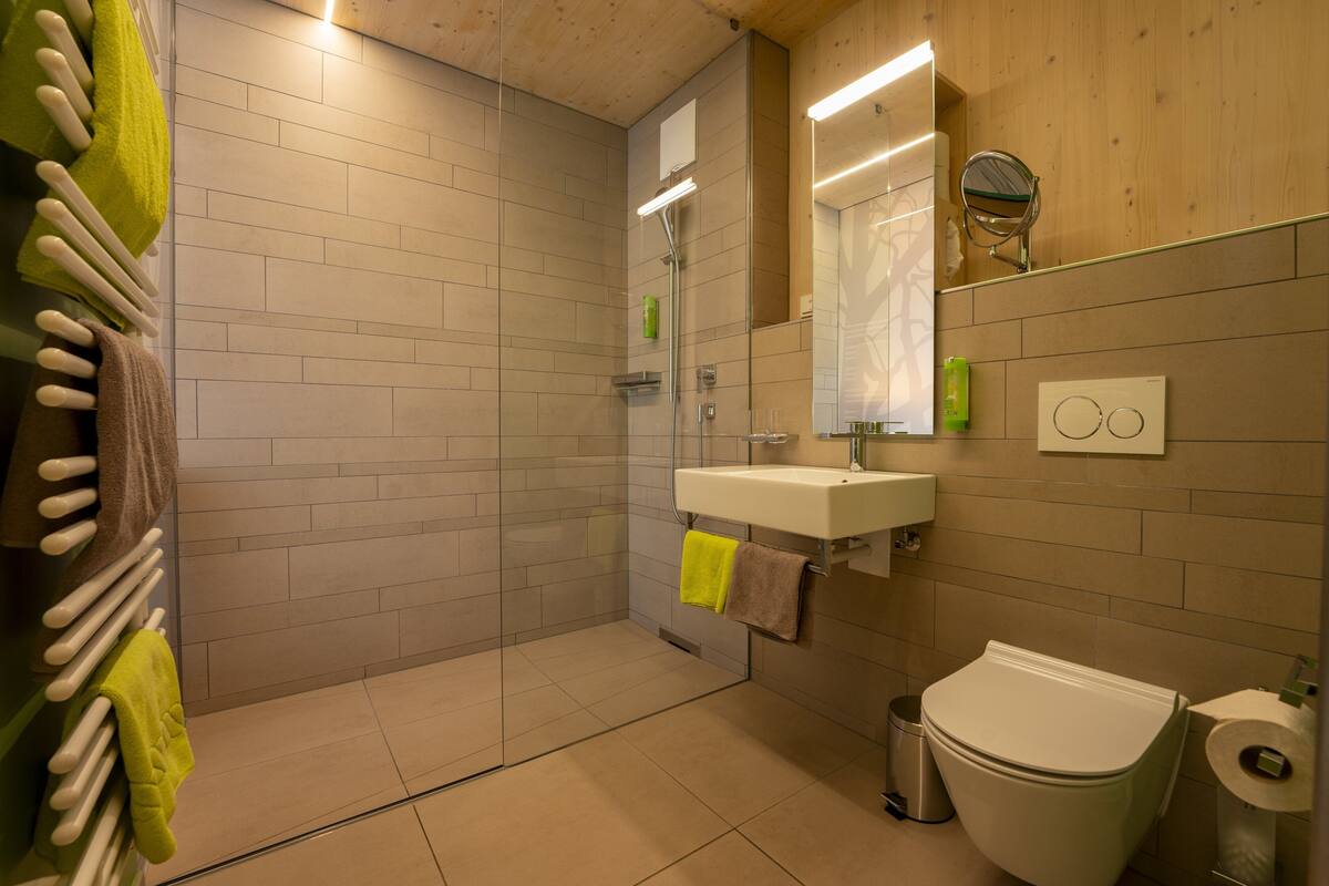 business double or twin room (baumkronenzimmer) | bathroom | eco-friendly toiletries, hair dryer, towels