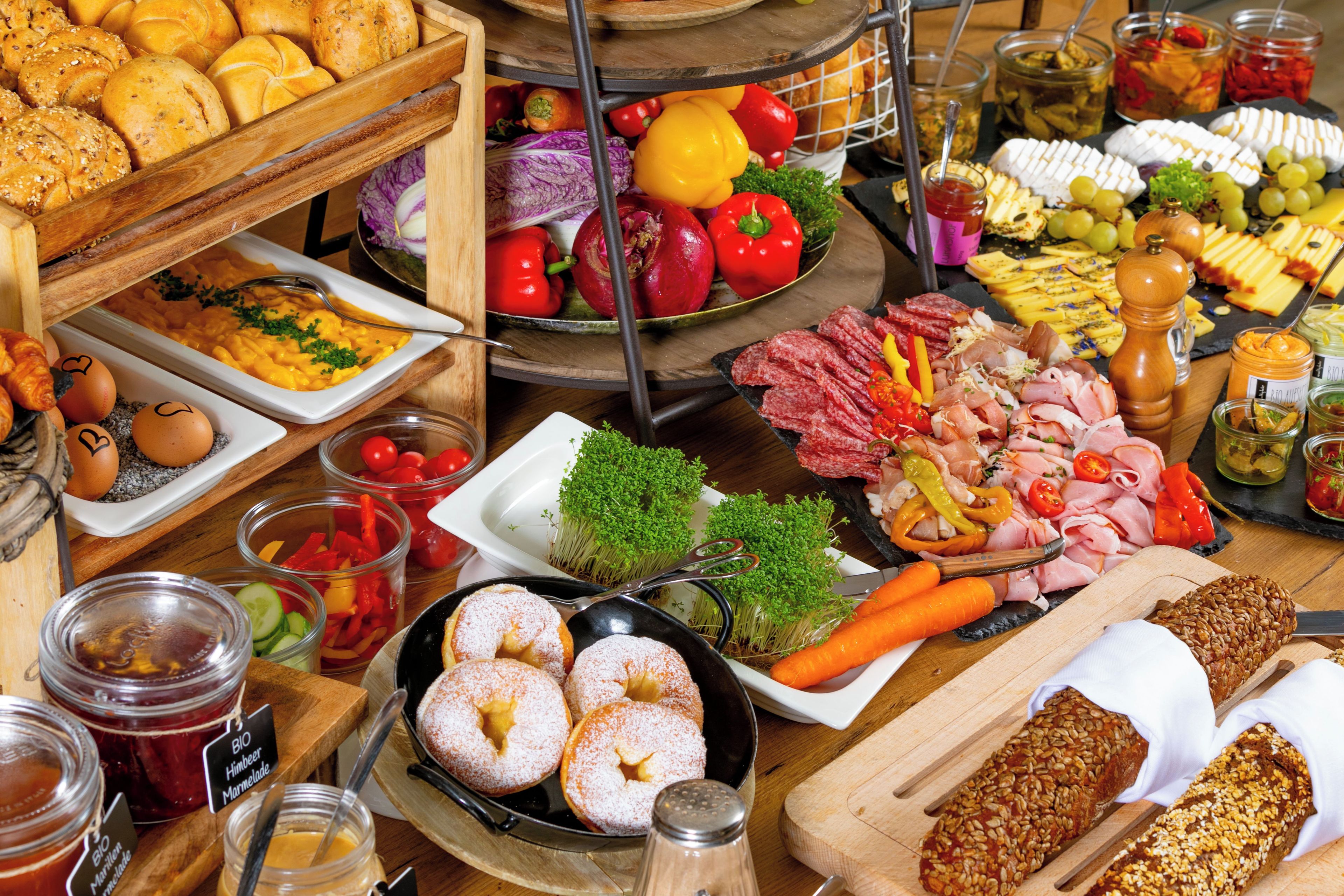 A variety of food items including bread, cheese, meats, and vegetables.