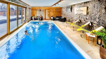 Indoor pool, open 9:00 AM to 10:00 PM, pool umbrellas, pool loungers