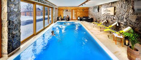 Indoor pool, open 9:00 AM to 10:00 PM, pool umbrellas, pool loungers