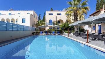 Seasonal outdoor pool, pool umbrellas, pool loungers