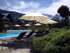 Outdoor pool, pool umbrellas, pool loungers