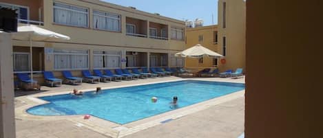 Outdoor pool, pool umbrellas, pool loungers
