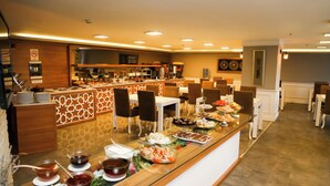 A buffet area with various food items and a coffee station. - Start Hotel (Antalya)